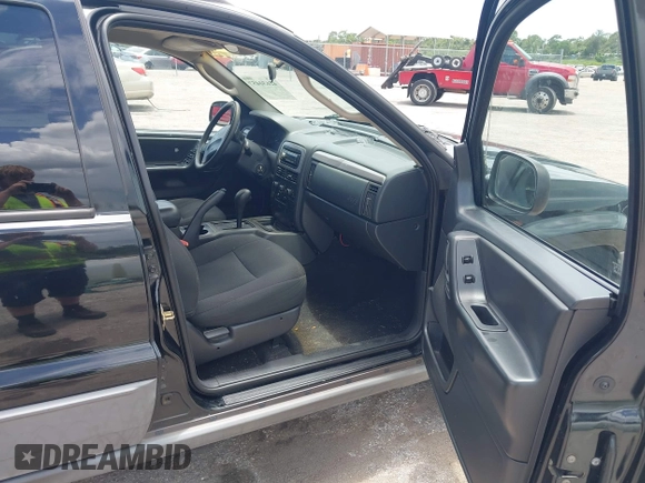 2002 Jeep Grand Cherokee Laredo with VIN 1J4GX48S22C226527, listed as a IAAI auction lot 42630457 with 197,333 mi miles and . Bid and sale history available at DreamBid. Image 5.