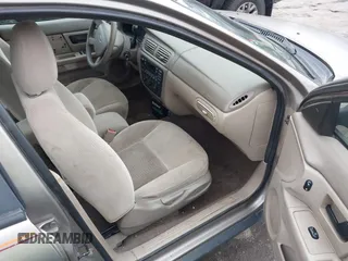 2005 Ford Taurus SE with VIN 1FAFP53215A127489, listed as a IAAI auction lot 40940239 with 127,180 mi miles. Bid and sale history available at carsss.com. Image 5.