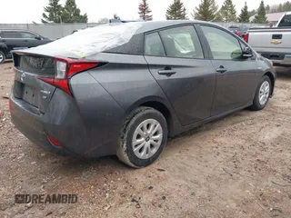 2021 Toyota Prius L Eco with VIN JTDKAMFU6M3140081, listed as a IAAI auction lot 42131187 with 103,973 mi miles and . Bid and sale history available at DreamBid. Image 4.