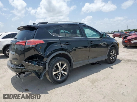2018 Toyota RAV4 XLE with VIN 2T3WFREV2JW433186, listed as a Copart auction lot 61008705 with 57,310 mi miles and Salvage title. Bid and sale history available at DreamBid. Image 3.