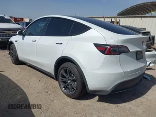 2024 Tesla Model Y with VIN 7SAYGDEDXRA300743, listed as a IAAI auction lot 41690374 with 12,446 mi miles and . Bid and sale history available at DreamBid. Image 3.