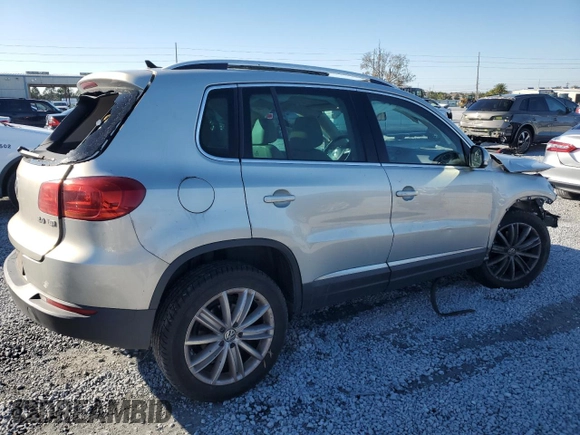 2014 Volkswagen Tiguan SE z VIN WVGAV3AXXEW502310, wystawiony jako Copart lot #42095985 z przebiegiem 130 033 mil mil oraz Szkoda całkowita • Salvage title. Historia ofert i sprzedaży dostępna na DreamBid. Obrazek 3.