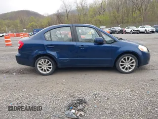 2011 Suzuki SX4 LE with VIN JS2YC5A23B6304713, listed as a IAAI auction lot 41997287 with 114,024 mi miles. Bid and sale history available at carsss.com. Image 13.