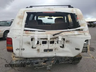 1995 Jeep Grand Cherokee Laredo with VIN 1J4GZ58Y6SC718918, listed as a Copart auction lot 72226394 with 212,670 mi miles and Salvage Title. Bid and sale history available at carsss.com. Image 6.