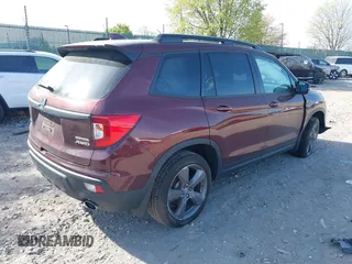 2021 Honda Passport Touring z VIN 5FNYF8H91MB022986, wystawiony jako IAAI lot #42077321 z przebiegiem 20 497 mil mil oraz . Historia ofert i sprzedaży dostępna na DreamBid. Obrazek 4.