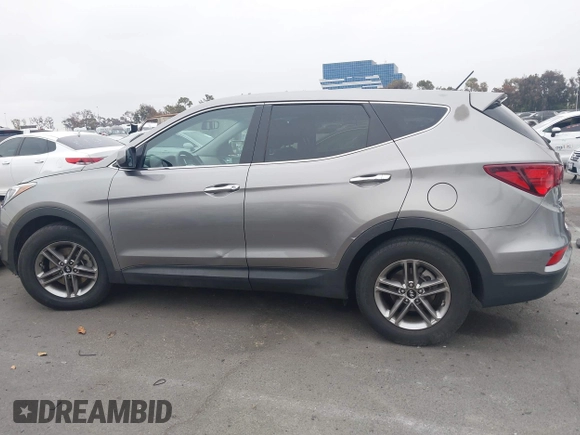 2018 Hyundai Santa Fe 2.4L with VIN 5XYZT3LB7JG569517, listed as a IAAI auction lot 42141100 with 57,854 mi miles and . Bid and sale history available at DreamBid. Image 15.