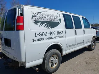 2012 Chevrolet Express Cargo Van with VIN 1GCWGFBA6C1156153, listed as a IAAI auction lot 42168661 with 233,473 mi miles. Bid and sale history available at carsss.com. Image 4.