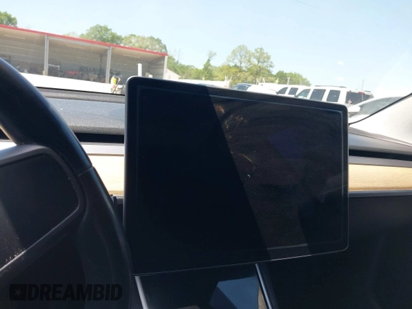 2018 Tesla Model 3 Long Range Battery with VIN 5YJ3E1EAXJF019907, listed as a IAAI auction lot 41995969 with Not Provided miles and . Bid and sale history available at DreamBid. Image 18.