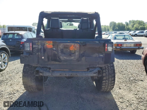 2015 Jeep Wrangler Unlimited Freedom with VIN 1C4BJWDG8FL689194, listed as a Copart auction lot 58016385 with 108,026 mi miles and Salvage title. Bid and sale history available at DreamBid. Image 6.