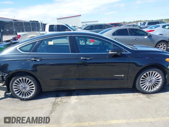 2013 Ford Fusion Titanium Hybrid with VIN 3FA6P0RU2DR288773, listed as a IAAI auction lot 41803708 with 85,868 mi miles and . Bid and sale history available at DreamBid. Image 13.