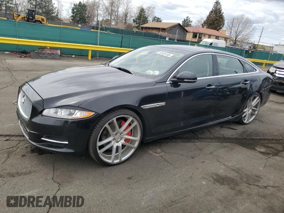 2014 Jaguar XJ Portfolio with VIN SAJWJ2GD4E8V69651, listed as a Copart auction lot 52426195 with 56,413 mi miles and Salvage title. Bid and sale history available at DreamBid. Image 1.