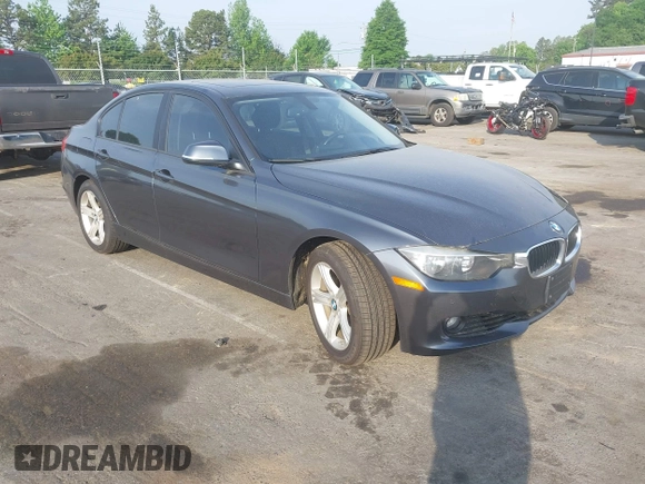 2013 BMW 3 Series 328i xDrive with VIN WBA3B3C53DJ810249, listed as a IAAI auction lot 42099473 with 125,255 mi miles. Bid and sale history available at carsss.com. Image 1.