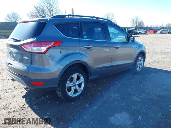 2014 Ford Escape SE with VIN 1FMCU0GXXEUB37821, listed as a IAAI auction lot 41853052 with 197,773 mi miles. Bid and sale history available at carsss.com. Image 4.