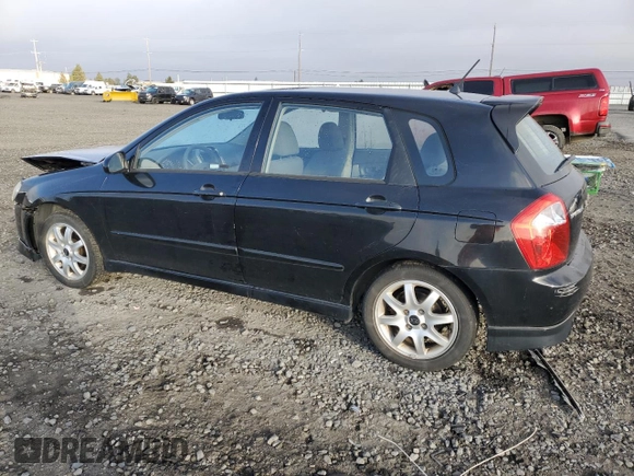 2005 Kia Spectra with VIN KNAFE161655093051, listed as a Copart auction lot 77821904 with 104,874 mi miles and Salvage Title. Bid and sale history available at carsss.com. Image 2.