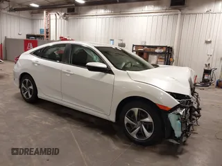 2020 Honda Civic LX with VIN 2HGFC2F65LH561434, listed as a IAAI auction lot 42167392 with 37,338 mi miles and . Bid and sale history available at DreamBid. Image 1.