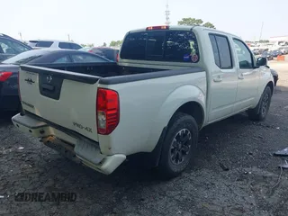 2015 Nissan Frontier S with VIN 1N6AD0EV0FN717018, listed as a IAAI auction lot 42322428 with 104,715 mi miles and . Bid and sale history available at DreamBid. Image 4.
