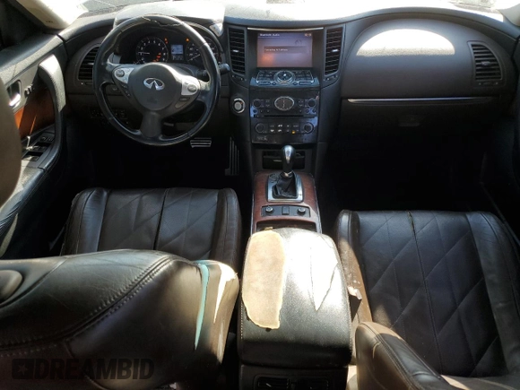 2014 Infiniti QX70 z VIN JN8CS1MU1EM451632, wystawiony jako Copart lot #50012035 z przebiegiem 246 212 mil mil oraz Szkody całkowita. Historia ofert i sprzedaży dostępna na DreamBid. Obrazek 8.