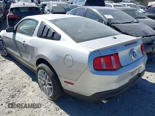 2012 Ford Mustang V6 Premium with VIN 1ZVBP8AM1C5265745, listed as a IAAI auction lot 41705931 with 145,000 mi miles. Bid and sale history available at carsss.com. Image 3.