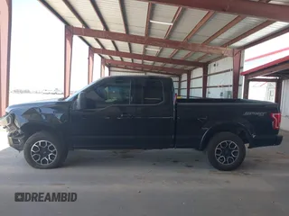2015 Ford F-150 XLT z VIN 1FTFX1EFXFKE32133, wystawiony jako IAAI lot #42260644 z przebiegiem 136 724 mil mil oraz . Historia ofert i sprzedaży dostępna na DreamBid. Obrazek 14.
