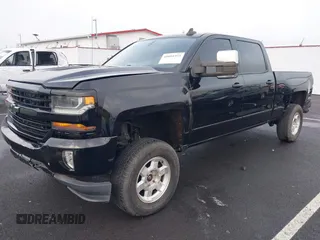 2017 Chevrolet Silverado 1500 LT with VIN 1GCUKREC1HF117744, listed as a IAAI auction lot 41091255 with 61,984 mi miles and . Bid and sale history available at DreamBid. Image 2.