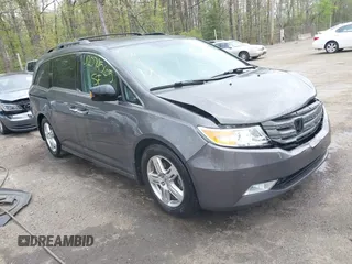 2013 Honda Odyssey Touring with VIN 5FNRL5H94DB013310, listed as a IAAI auction lot 42079565 with 128,622 mi miles and . Bid and sale history available at carsss.com. Image 1.