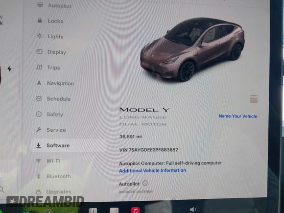 2023 Tesla Model Y Long Range with VIN 7SAYGDEE2PF883687, listed as a IAAI auction lot 41589837 with 36,890 mi miles. Bid and sale history available at carsss.com. Image 7.