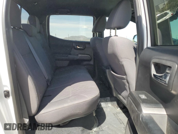 2019 Toyota Tacoma SR z VIN 3TMCZ5AN1KM263494, wystawiony jako Copart lot #54710695 z przebiegiem 57 216 mil mil oraz Szkoda całkowita • Salvage title. Historia ofert i sprzedaży dostępna na DreamBid. Obrazek 10.