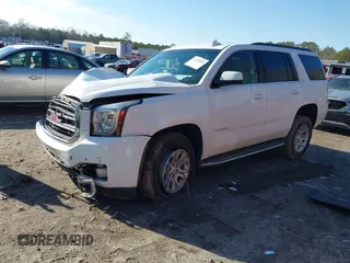 2019 GMC Yukon SLT with VIN 1GKS2BKC9KR166896, listed as a IAAI auction lot 41429865 with 165,174 mi miles. Bid and sale history available at carsss.com. Image 2.