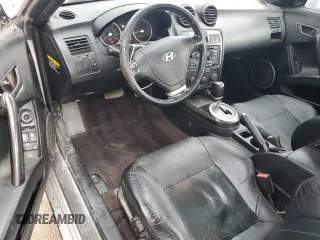 2003 Hyundai Tiburon GT z VIN KMHHN65F13U013420, wystawiony jako Copart lot #51234495 z przebiegiem 230 612 mil mil oraz Szkoda całkowita • Salvage title. Historia ofert i sprzedaży dostępna na DreamBid. Obrazek 8.