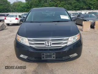 2011 Honda Odyssey Touring with VIN 5FNRL5H90BB070472, listed as a IAAI auction lot 42367710 with 203,589 mi miles and . Bid and sale history available at DreamBid. Image 6.