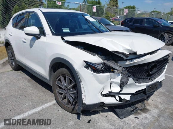 2018 Mazda CX-5 Grand Touring with VIN JM3KFADM8J0373368, listed as a IAAI auction lot 42013535 with 63,142 mi miles and . Bid and sale history available at DreamBid. Image 1.