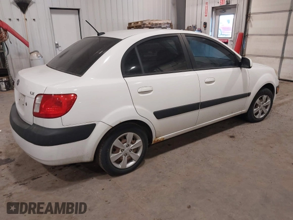 2009 Kia Rio SX with VIN KNADE223896533839, listed as a IAAI auction lot 41328220 with 140,968 mi miles. Bid and sale history available at carsss.com. Image 4.