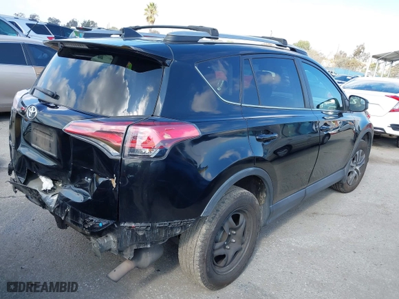 2018 Toyota RAV4 LE with VIN 2T3ZFREVXJW457751, listed as a IAAI auction lot 41529251 with 230,054 mi miles. Bid and sale history available at carsss.com. Image 4.