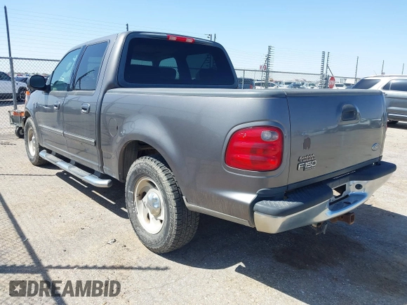 2003 Ford F-150 XLT with VIN 1FTRW07L63KA65904, listed as a IAAI auction lot 41983556 with 166,086 mi miles. Bid and sale history available at carsss.com. Image 3.