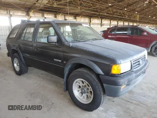 1995 Honda Passport z VIN 4S6CY58V4S4406803, wystawiony jako Copart lot #73057084 z przebiegiem 161 118 mil mil oraz Szkody całkowita. Historia ofert i sprzedaży dostępna na DreamBid. Obrazek 4.
