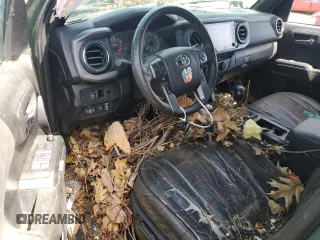 2021 Toyota Tacoma 4WD SR5 with VIN 3TMDZ5BNXMM099474, listed as a Copart auction lot 49325385 with 57,853 mi miles and Salvage Title. Bid and sale history available at carsss.com. Image 8.