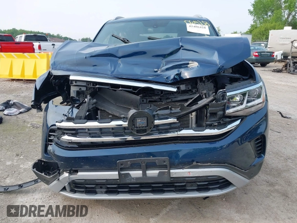 2022 Volkswagen Atlas SE z VIN 1V2KC2CA9NC216742, wystawiony jako IAAI lot #42406428 z przebiegiem 34 598 mil mil oraz . Historia ofert i sprzedaży dostępna na DreamBid. Obrazek 12.