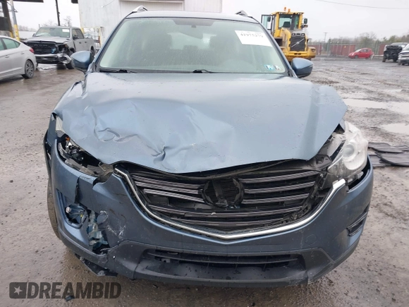 2016 Mazda CX-5 Sport with VIN JM3KE4BY5G0727608, listed as a IAAI auction lot 41975279 with 95,817 mi miles and . Bid and sale history available at carsss.com. Image 12.