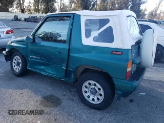 1995 Suzuki Sidekick z VIN 2S3TA02C3S6414337, wystawiony jako Copart lot #86304134 z przebiegiem 104 889 mil mil oraz Szkody całkowita. Historia ofert i sprzedaży dostępna na DreamBid. Obrazek 2.