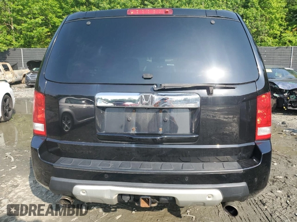 2011 Honda Pilot Touring z VIN 5FNYF4H92BB090512, wystawiony jako Copart lot #57046015 z przebiegiem 159 814 mil mil oraz Szkoda całkowita • Salvage title. Historia ofert i sprzedaży dostępna na DreamBid. Obrazek 6.