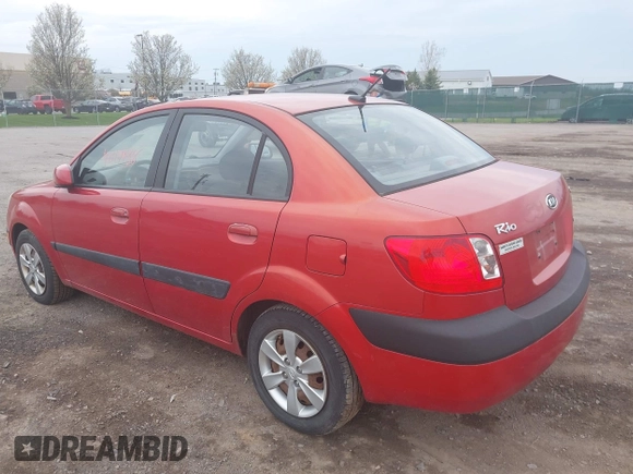 2009 Kia Rio SX with VIN KNADE223996556806, listed as a IAAI auction lot 42117938 with 54,007 mi miles. Bid and sale history available at carsss.com. Image 3.