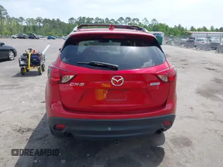 2014 Mazda CX-5 Grand Touring with VIN JM3KE2DY3E0382920, listed as a IAAI auction lot 42102876 with 324,608 mi miles. Bid and sale history available at carsss.com. Image 16.