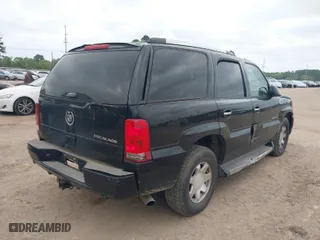 2005 Cadillac Escalade with VIN 1GYEC63TX5R203156, listed as a IAAI auction lot 41937137 with 239,919 mi miles. Bid and sale history available at carsss.com. Image 4.