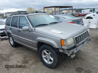 1998 Jeep Grand Cherokee Limited with VIN 1J4GZ88Z7WC223496, listed as a IAAI auction lot 41484317 with 244,567 mi miles. Bid and sale history available at carsss.com. Image 1.