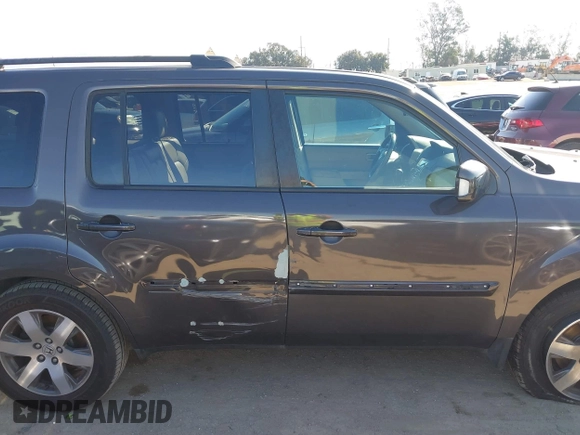 2015 Honda Pilot Touring with VIN 5FNYF3H94FB002236, listed as a IAAI auction lot 41735221 with 112,766 mi miles. Bid and sale history available at carsss.com. Image 13.