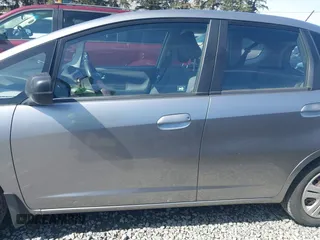 2010 Honda Fit with VIN JHMGE8H20AC010062, listed as a IAAI auction lot 41964011 with 104,651 mi miles. Bid and sale history available at carsss.com. Image 14.