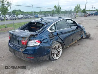2016 BMW 4 Series 428i with VIN WBA4A9C52GGL88003, listed as a IAAI auction lot 42225642 with 105,054 mi miles and . Bid and sale history available at DreamBid. Image 4.