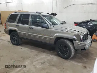 1996 Jeep Grand Cherokee Limited with VIN 1J4GZ78S5TC210710, listed as a Copart auction lot 81307904 with 285,169 mi miles and Salvage Title. Bid and sale history available at carsss.com. Image 4.