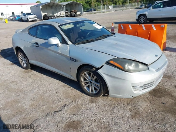 2008 Hyundai Tiburon GS with VIN KMHHM66D98U292591, listed as a IAAI auction lot 42021445 with 219,750 mi miles. Bid and sale history available at carsss.com. Image 1.