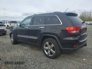 2013 Jeep Grand Cherokee Overland with VIN 1C4RJFCGXDC643802, listed as a Copart auction lot 52429535 with 122,014 mi miles and Salvage Title. Bid and sale history available at carsss.com. Image 2.